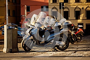 Parked scooters in an Italian old town.