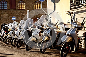 Parked scooters in an Italian old town.