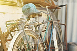 Parked vintage bicycles bikes for rent on sidewalk.