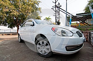 Parked white motor car