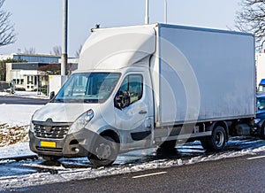 Parked white truck during winter, logistics and transportation business, vehicles and equipment