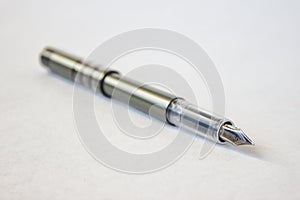 Parker pen laying on paper background.