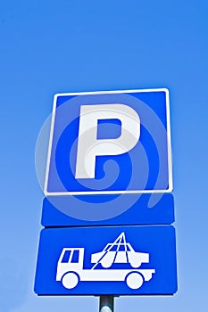 Parking blue sign against blue sky