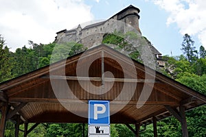 Parking booth made of wood with traffic sign for parking in area around Orava castle in Slovakia.