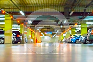 Parking car blurred. Empty road asphalt background in soft focus. Car lot parking space in underground city garage