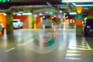 Parking car blurred. Empty road asphalt background in soft focus. Car lot parking space in underground city garage