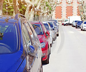 Parking cars in the city, many automobiles