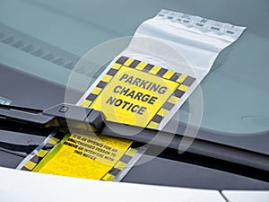 Parking fine ticket on wind screen of vehicle