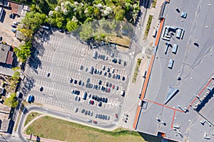 Parking lot, aerial top view. a lot of cars parked near city shopping mall