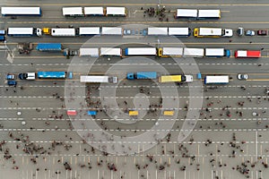 A parking lot full of passenger buses. Aerial view from above.