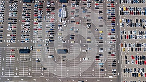 Parking lot with many cars aerial top drone view from above, city transportation