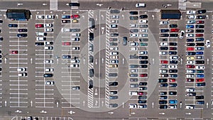 Parking lot with many cars aerial top drone view from above, city transportation