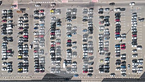 Parking lot with many cars aerial top drone view from above, city transportation