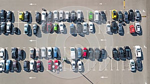 Parking lot with many cars aerial top drone view from above, city transportation