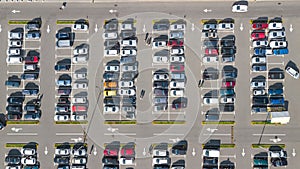 Parking lot with many cars aerial top drone view from above, city transportation