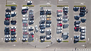 Parking lot with many cars aerial top drone view from above, city transportation