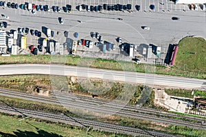 Parking lot near the farmers market in suburb area. aerial top view