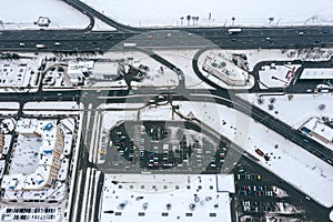 Parking lot in suburb residential area. urban roads with car traffic. aerial view