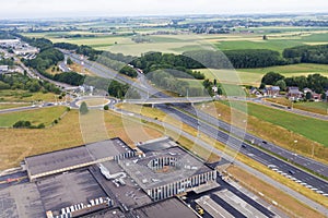 Parking lot, suspended highway, highway and agriculture fields