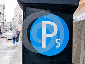 Parking machine in Montreal, with a blurred background, Quebec, Canada