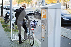 Parking machine with solar panel in the city street.