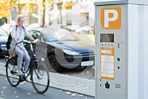 Parking machine with solar panel in the city street.