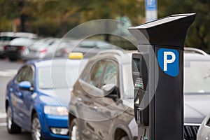 Parking machine with solar panel in the city street.