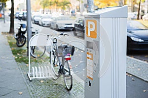 Parking machine with solar panel in the city street.