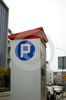 Parking machine with solar panel in the city street.