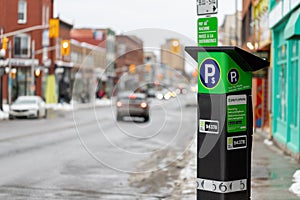 Parking meter on the street of Ottawa city, Canada. Pay by phone available