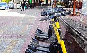 Parking of modern electric scooters on city streets.