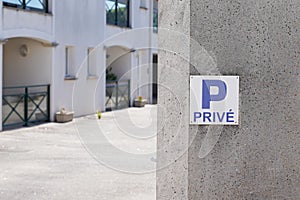 Parking p privÃÂ© french text sign blue means private parking car parked in city street photo