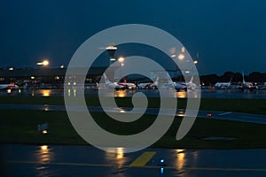 Parking of passenger aircraft at the airport. Evening rain