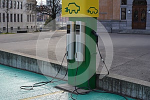 Parking place with charging stations for electric cars in green and yellow in  city Winterthur in Switzerland.