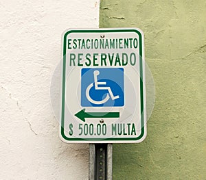 Parking reserved for handicapped only in spanish photo