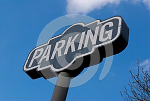 A parking sign on a bright blue sky