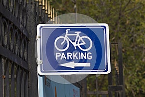 Parking sign pointer bicycle.