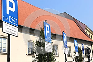 A parking signs in the row.
