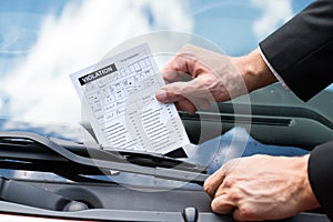 Parking ticket on car's windshield