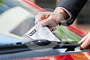 Parking ticket on car's windshield