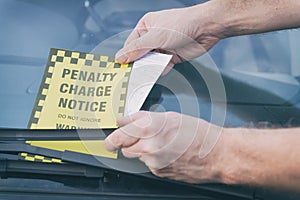Parking ticket under windshield wiper