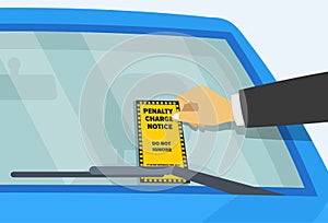 Parking violation ticket fine on the windshield of car.