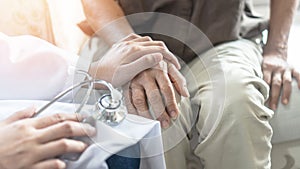 Parkinson disease patient, Alzheimer elderly senior, Arthritis person's hand in support of geriatric doctor
