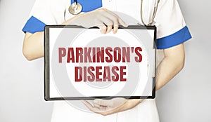 Parkinson`s disease card in hands of Medical Doctor