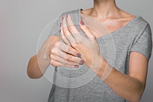 Parkinson`s disease symptoms. Close up of tremor shaking hands of Middle-aged women patient with Parkinson`s disease photo