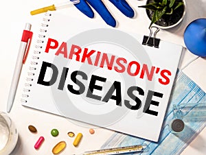 Parkinson's disease text on paper with heart beat diagram