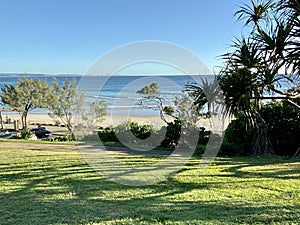 Parklands behind a Gold Coast beach towards Surfers Paradise in the distance