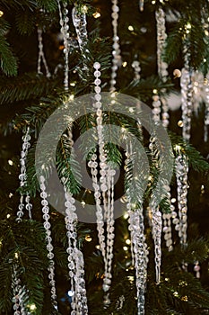 parkling Christmas tree with crystal garlands.