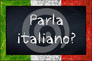 Parla italiano blackboard with italy flag frame photo