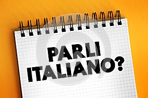 Parli Italiano? do you speak Italian? text on notepad, concept background